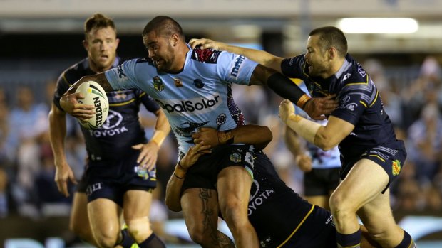 Smash and grab: Andrew Fifita forces his way through the defensive line.