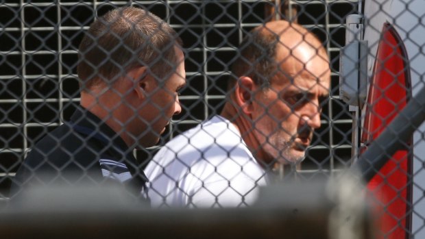 Michael Cardamone is taken into Wangaratta Court on Tuesday.