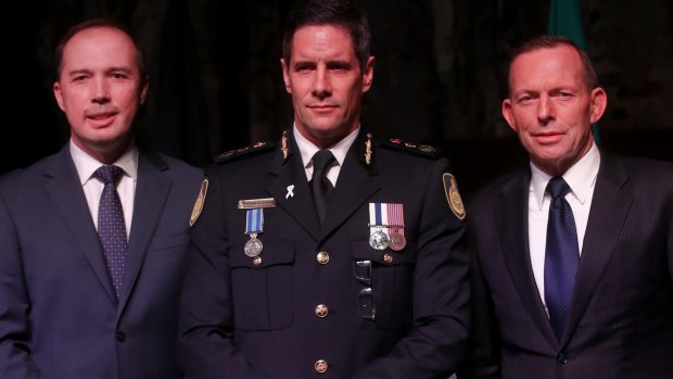 Australian Border Force commissioner Roman Quaedvlieg, centre, with Peter Dutton and then prime minister Tony Abbott.