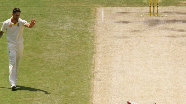 Profuse apologies: Mitchell Johnson makes amends for his shy at the stumps.