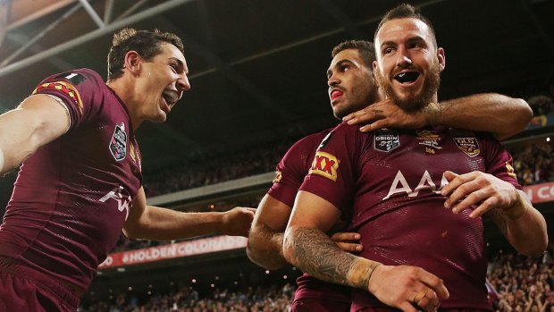 Injured: Maroons back Darius Boyd, right, may be out for the 2015 NRL season after snapping his Achilles during Broncos training.