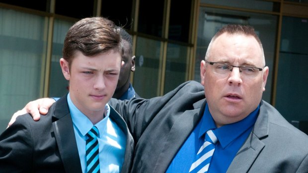Karl Sisson with his son Jordan are seen at the funeral of Josiah Sisson.