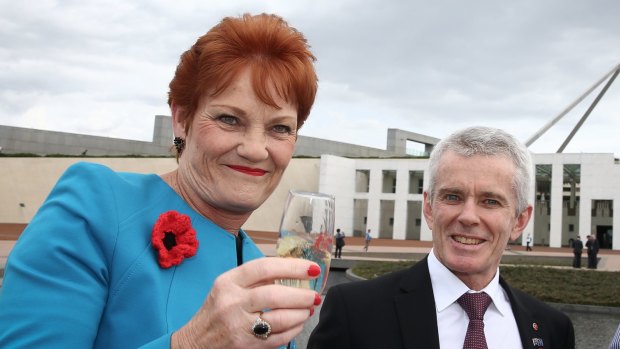 Senator Pauline Hanson with Senator Malcolm Roberts at Parliament House.