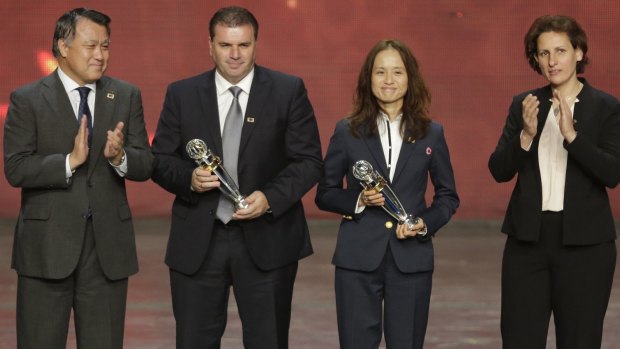 Trophy time: Australia's Ange Postecoglou, second left and Japan's Asako Takakura, second right hold their Coach of the year awards during the Asian Football Confederation (AFC) annual awards in New Delhi.