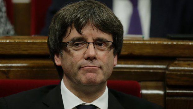 Catalan regional President Carles Puigdemont waits to make his opening speech at the parliament in Barcelona.