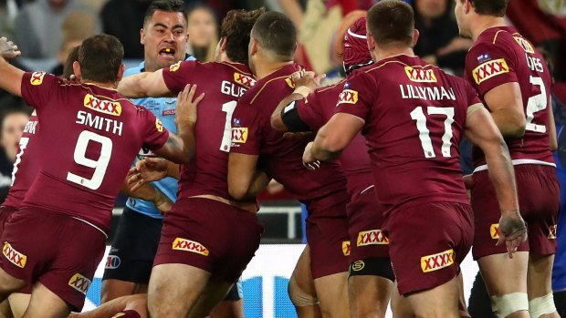 Outnumbered: Andrew Fifita takes on most of the Maroons side.