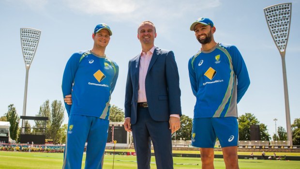 Australian captain Steven Smith with ACT Chief Minister Andrew Barr and spinner Nathan Lyon at Manuka Oval.