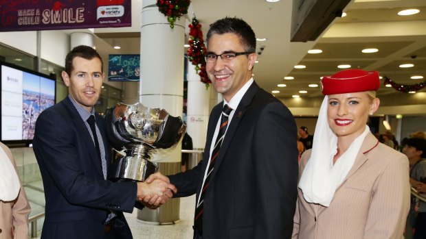 New FFA executive Mark Falvo (centre) shaking hands with ex Socceroo Brett Emerton during the Asian Cup trophy tour last year.