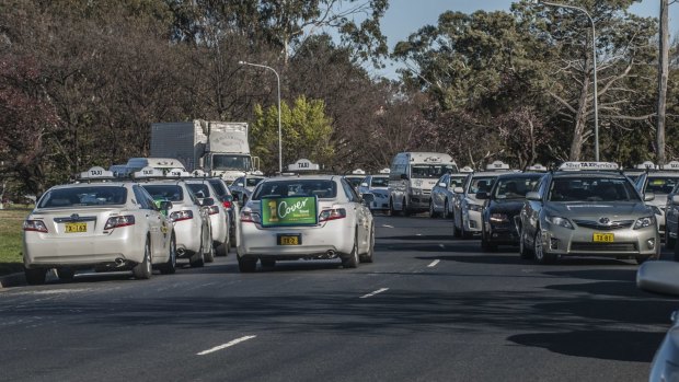 Private owners of ACT taxi plates will wait for another year before pressing for compensation, Phil Button says.