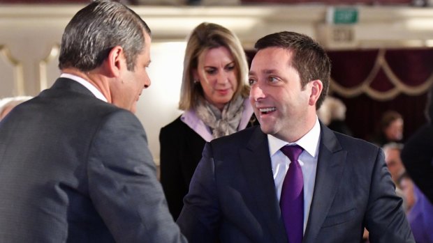 Former premier Steve Bracks greets Opposition Leader Matthew Guy.