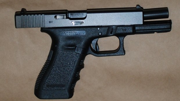 One of two illegal Glock pistols seized by police after searching the teddy bear.