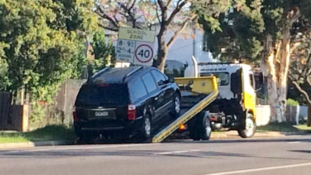 A tow truck arrived just before 6.20pm and the black Kia minivan was loaded onto the tray of the truck before it was towed from the scene.