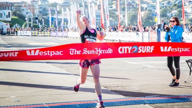 Cassie Fien, the first woman to cross the finish line at the 2016 City2Surf at Bondi Beach.