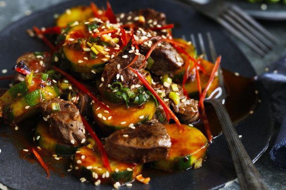 Add some chopped kimchi and rice to make a meal of this fiery beef and cucumber combination.