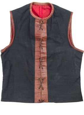 Demons jumper, 1900. Melbourne jumpers were made of sturdy blue linen, with a red leather strip hen down the front with eyelets and lacing.
