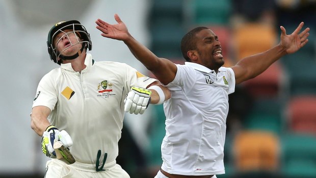 Australia's Steven Smith, left, collides with South Africa's Vernon Philander during an lbw appeal.
