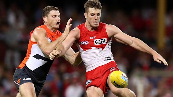 In hot water: Heath Shaw closes in on Luke Parker.