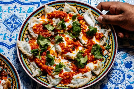 Go-to dish: Aushak dumplings, carefully pleated and topped with lentils warmed in a spiced tomato sauce.