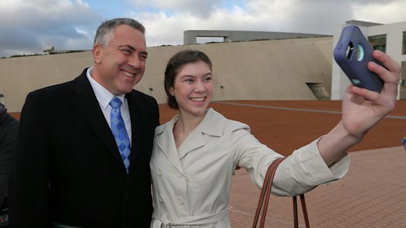 Treasurer Joe Hockey poses for a selfie with Anika Buining during a morning doorstop at Parliament.