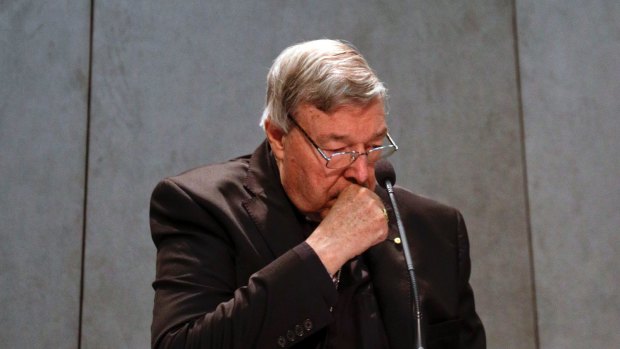 Cardinal George Pell makes a statement at the Vatican on Thursday.