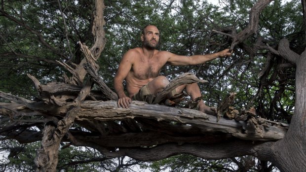 Ed Stafford tests his survival skills as a topless man versus wild, in <i>Marooned</i>.