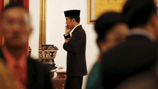 REFILE - ADDITIONAL CAPTION INFORMATION

Indonesia's President Joko Widodo talks on a mobile phone following a ceremony at the Presidential Palace in Jakarta, Indonesia April 28, 2015. Australian Foreign Minister Julie Bishop said she had received a letter from her Indonesian counterpart that gave no indication Widodo would change his mind and grant the clemency requested by Australia for two Australian convicted drug traffickers - Myuran Sukumaran and Andrew Chan.   REUTERS/Darren Whiteside