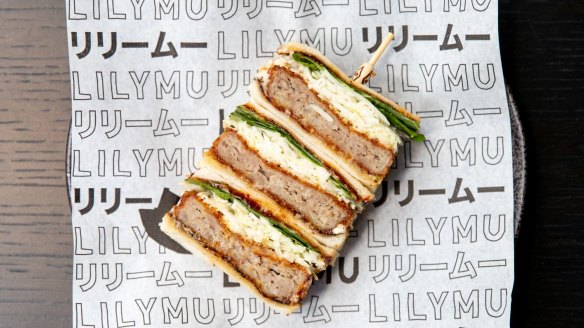Duck katsu sando with layers of crumbed minced duck, chilli jam, raw shredded cabbage and Thai herbs.