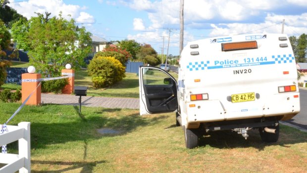 Police outside Simone Mottram's home in Froude Street, Inverell, where her son is accused of stabbing her to death. 