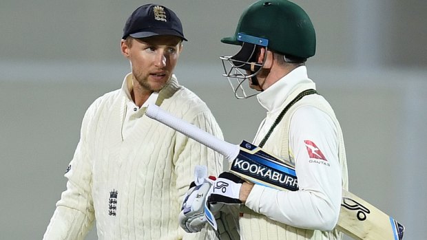 Plenty of feeling: England captain Joe Root and Australian batsman Peter Handscomb share words after stumps.