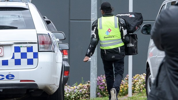  A Domino's Pizza deliveryman delivers an order to the centre on Monday aternoon.