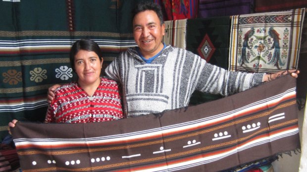 Miguel and Racquel Hernandez with Miguel's hand woven crafts.