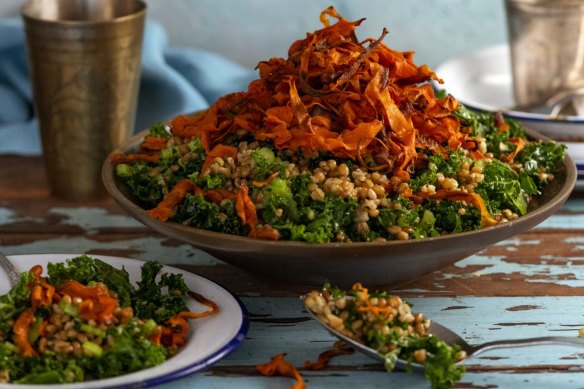 Toasted freekeh salad topped with crispy carrot.