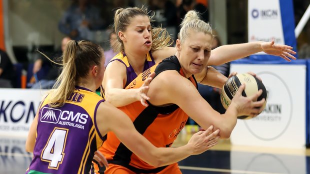 Team defence: Boomers Rebecca Cole and Olivia Thompson desperately pressure Suzy Batkovic in the final minute of the game.