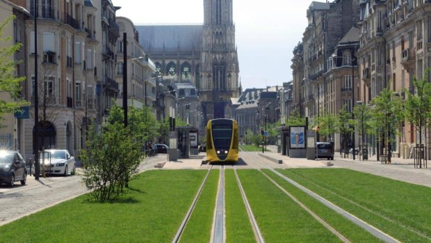 The tramway in Reims, with the cathedral in the background.
