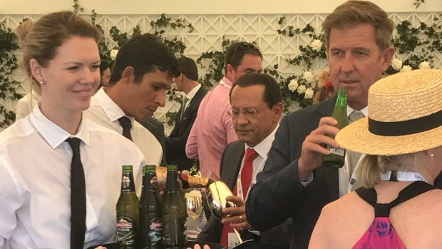 Channel Seven CEO Tim Worner, right, enjoys a drink at the Magic Millions.