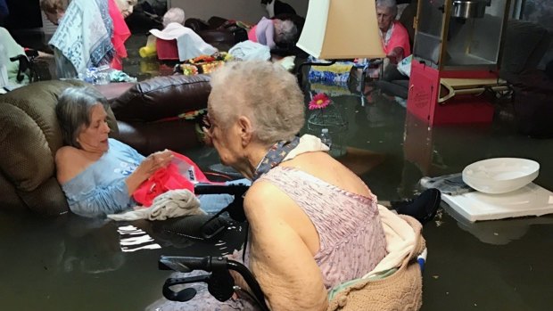 The viral image: residents of the La Vita Bella nursing home in Dickinson, Texas, sit in waist-deep flood waters caused by Hurricane Harvey. 