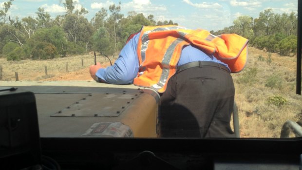 The co-driver of the train took this photo of the colleague climbing onto the bonnet of the train.