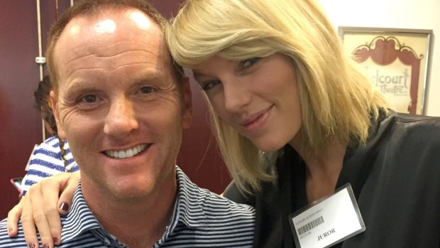 Potential juror and pop star Taylor Swift poses for a photo with Bryan Merville in a courthouse waiting area in Nashville.