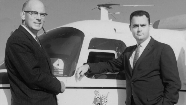 David Edgerton, right, with his Burger King partner, James W. McLamore, in the 1960s beside a company plane.