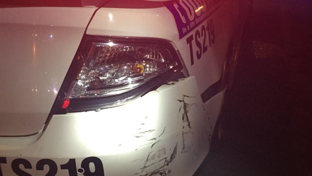The damage sustained to the police car. 