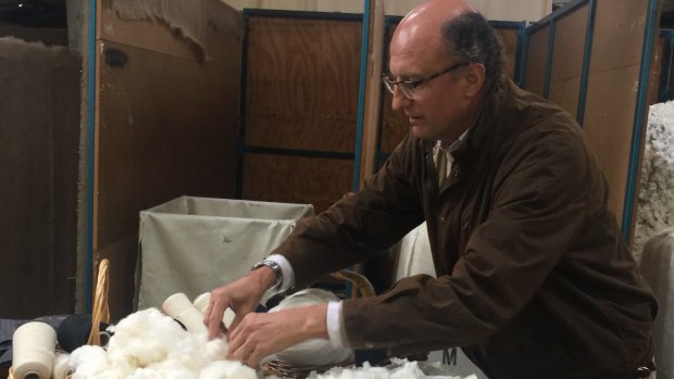 Fashionable farming: Paolo Zegna samples the wool at Achill Farm.
