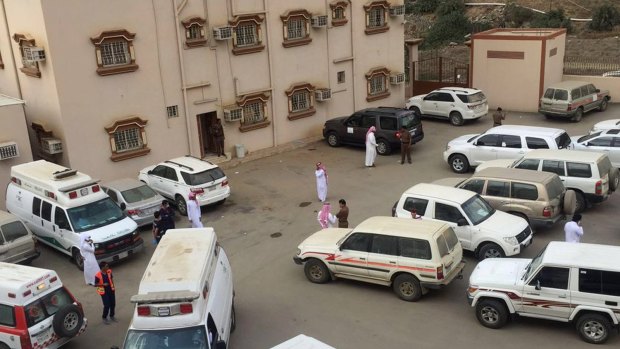 Ambulances and police vehicles are seen outside of the Ministry of Education office, located in Al-Dayer, Jazan region, Saudi Arabia. Six people were killed by a gunman in the education department in southern Saudi Arabia.