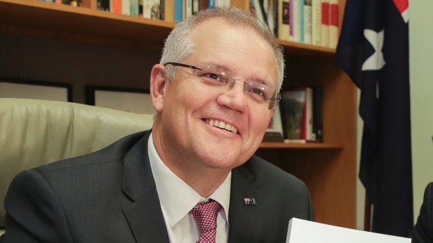Treasurer Scott Morrison with budget papers in the Treasurer's office at Parliament House.