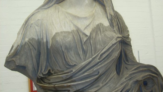 Heavily ingrained dirt had turned the marble of the high priestess black. She was cleaned in preparation for the Rome: City and Empire exhibition.