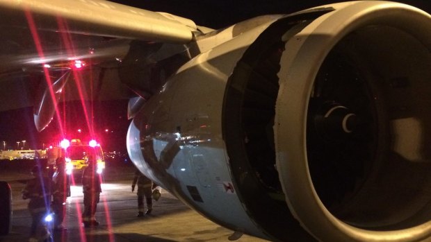 Huge hole: The China Eastern Airlines Airbus A330 on the tarmac after an emergency landing in Sydney last night due to engine failure 