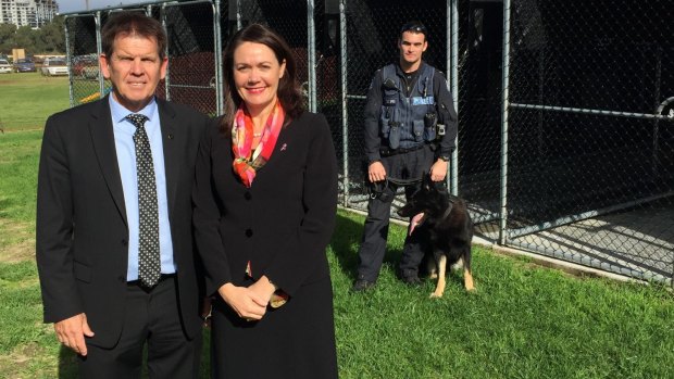 Liza Harvey with a police dog handler and a member of the new party dog squad.