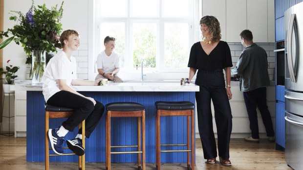 The new kitchen is where this family of keen foodies congregates most. The white tiles are from De Fazio Tiles and the cabinetry is painted in Vintage Denim from British Paints.
