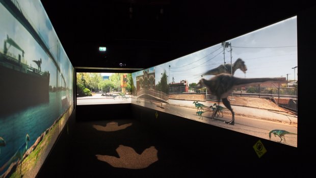 Immersive projections of tyrannosaurs roaming around Spotswood in Scienceworks exhibition <i>Tyrannosaurs - Meet the Family at Scienceworks</i>.
