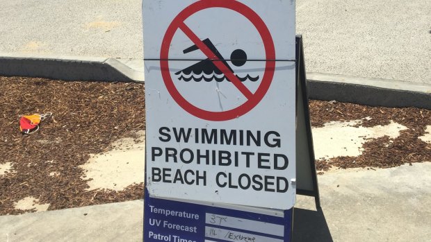 Swimming Prohibited, Beach Closed sign, re-erected outside St Kilda life saving club.