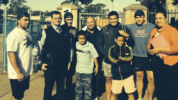 Free: Leighton and Epalahame Tali meet up with friends and family outside Villawood Detention Centre on Wednesday.